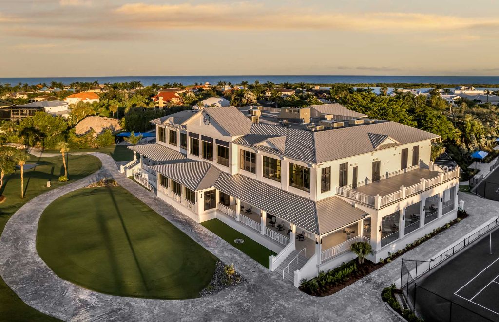 Aerial view of luxury Florida estate with pool and tennis court